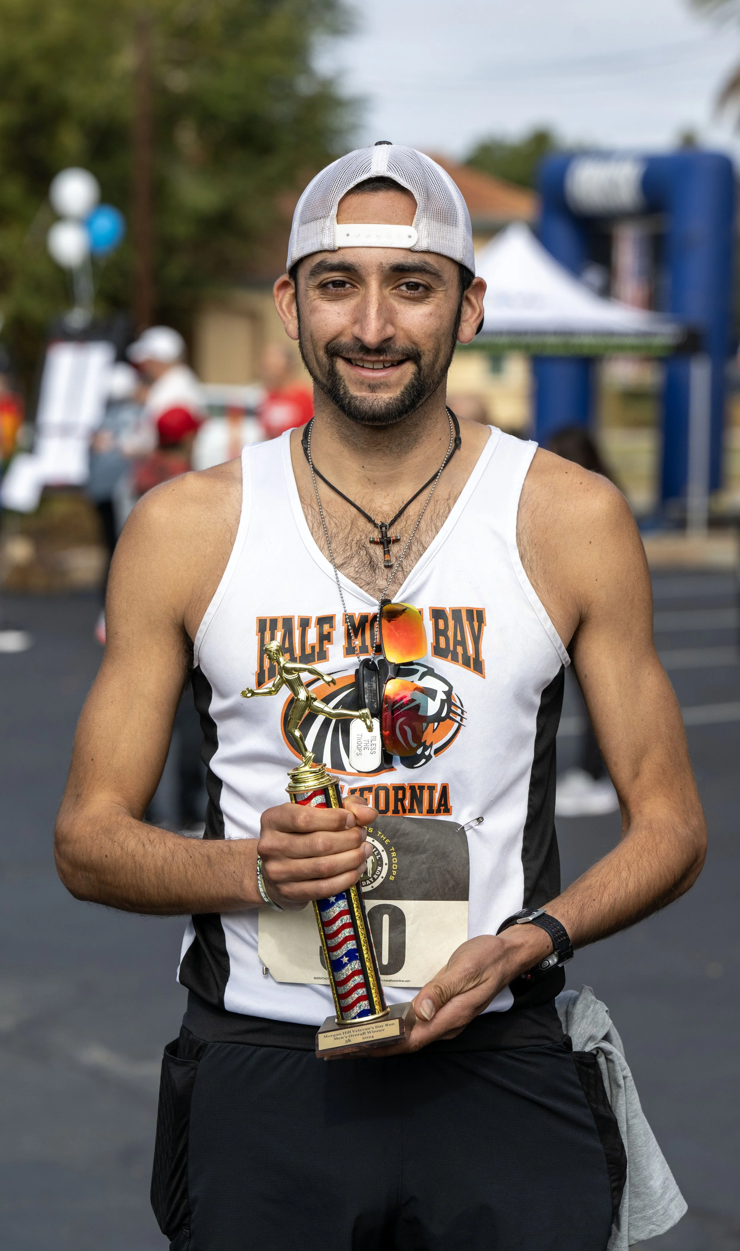 Veteran athlete holding a race trophy